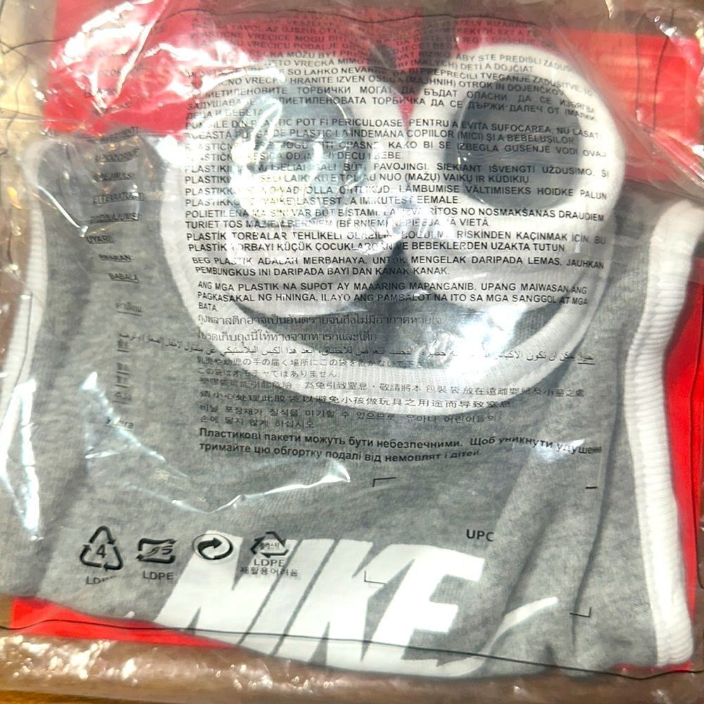 Brand New in wrapper Nike Baby Bib and Booties size 0-6 Months